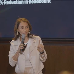 Sol Rashidi - the world's first Chief AI Officer - delivers a panel talk. She speaks into a microphone while smiling.