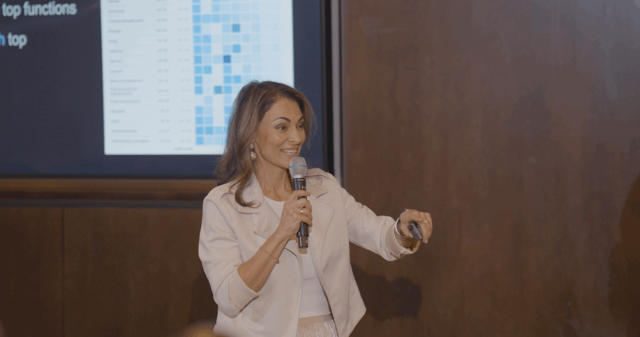 Sol Rashidi - the world's first Chief AI Officer - delivers a panel talk. She speaks into a microphone while smiling.